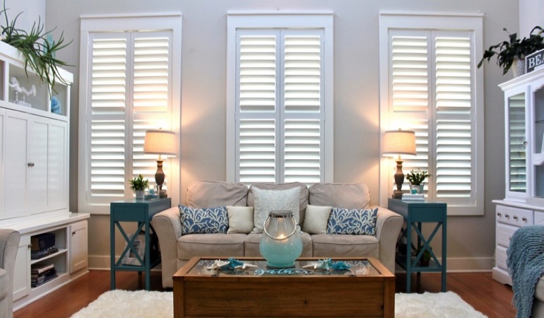 Jacksonville designer sunroom with white shutters 